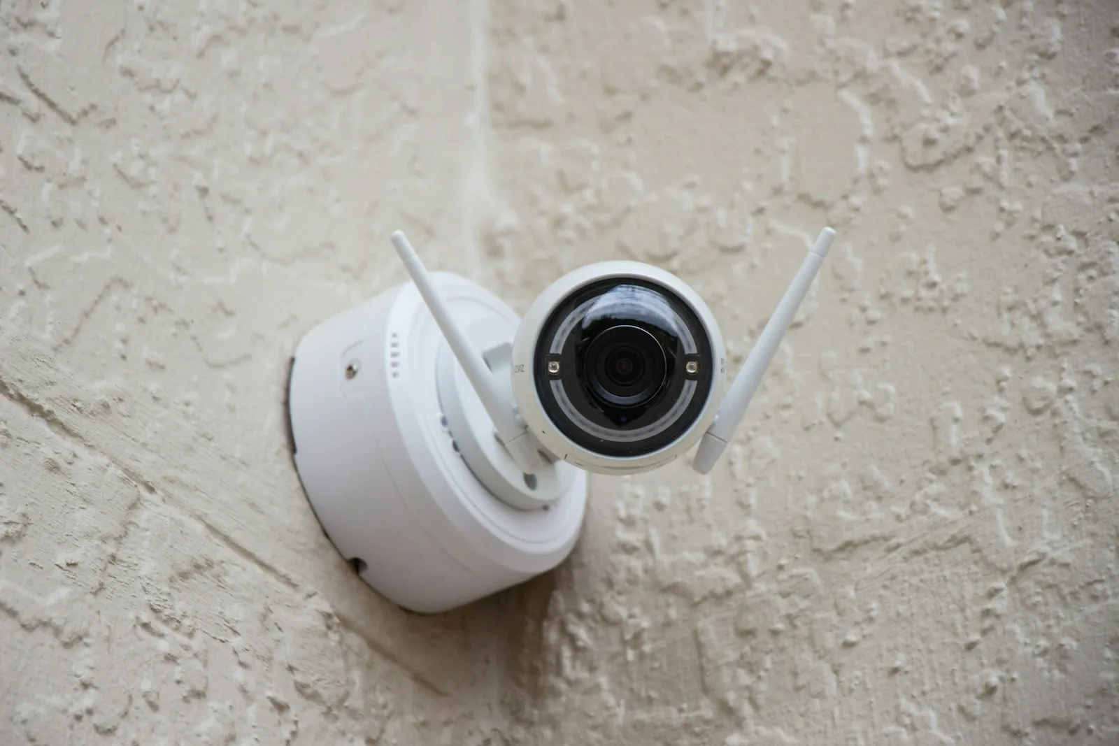 A wall-mounted security camera in a real building