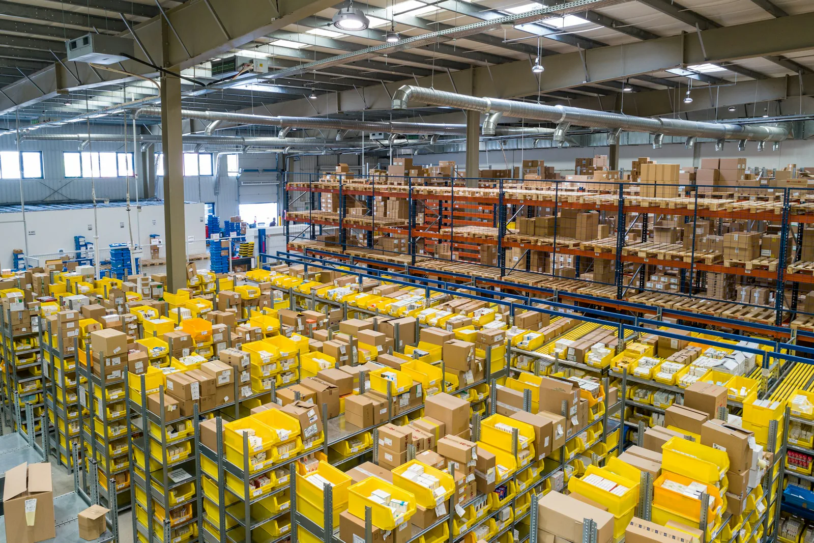 A large warehouse with organized inventory and storage racks